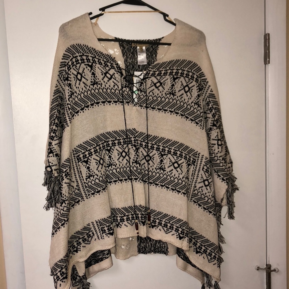 With tags poncho
